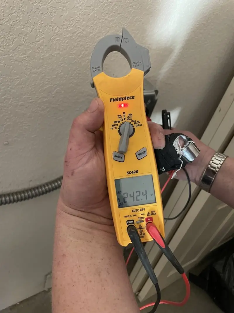 Voltage testing with clamp meter during Generator Installation in St. James